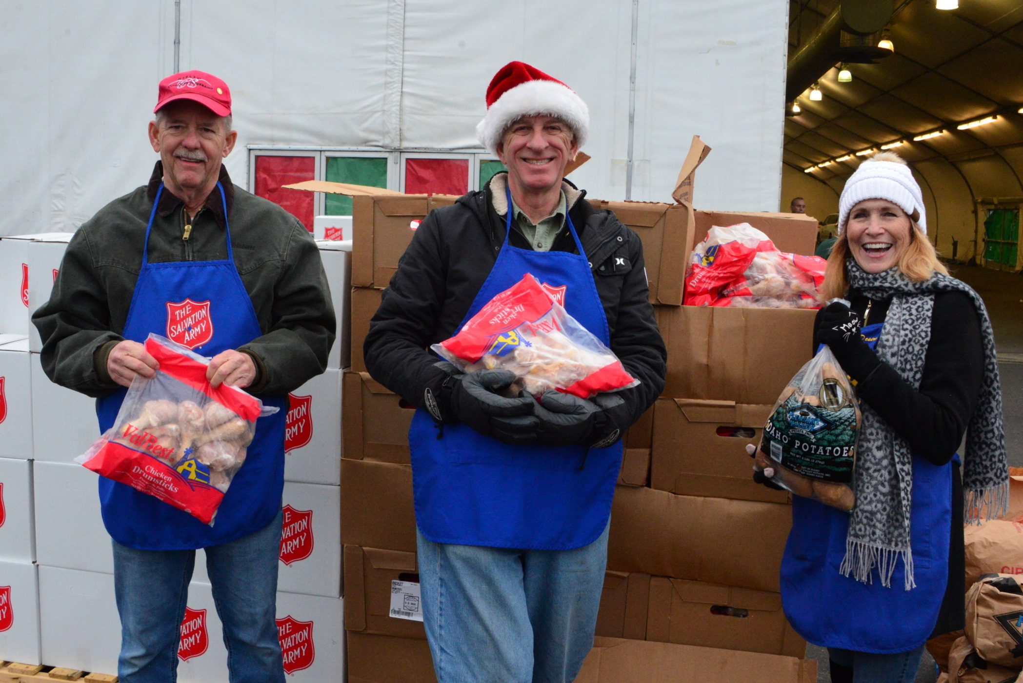 3 PWR members giving out food for the Salvation Army Food Drive